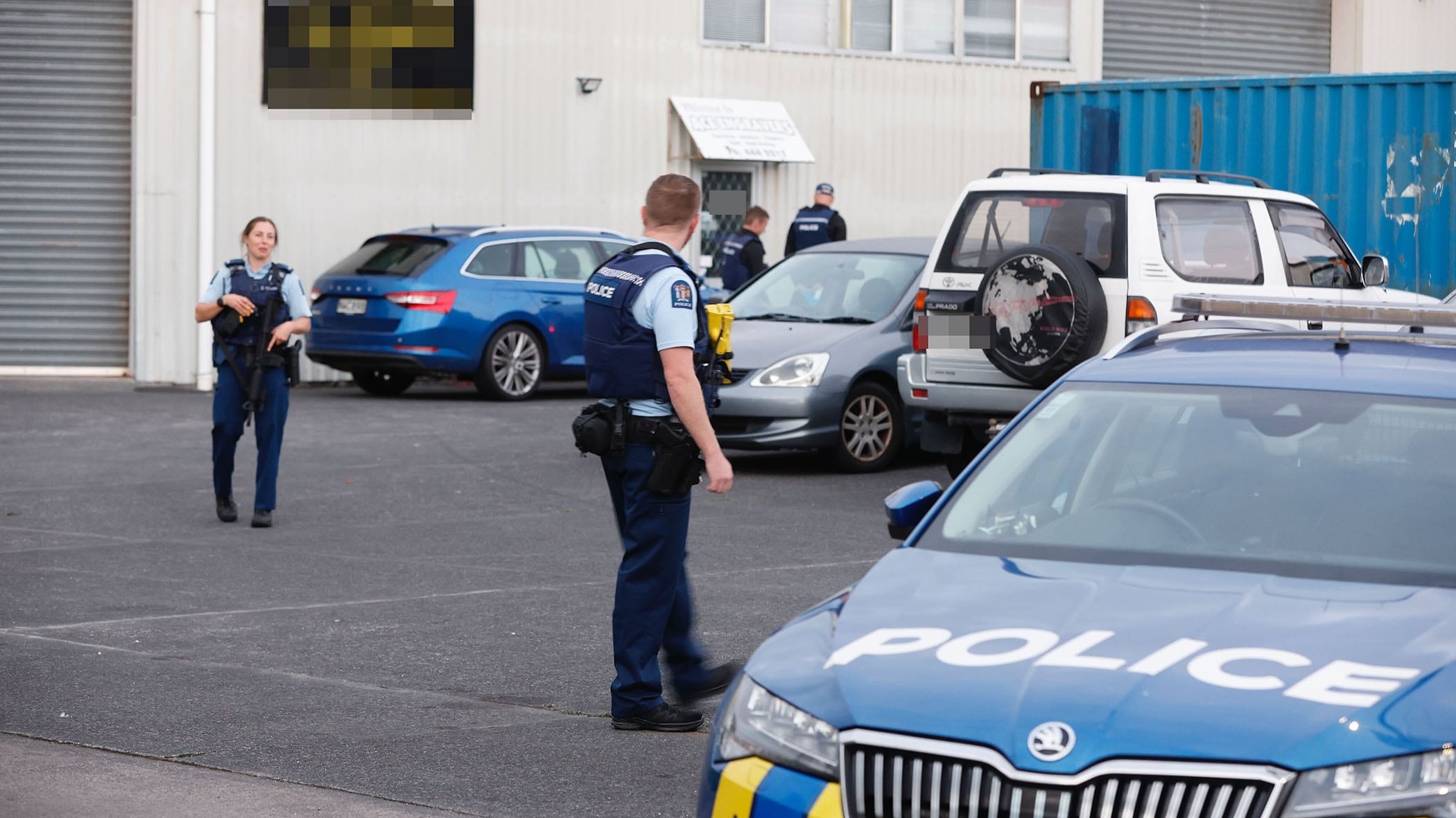 Police, including members of the Armed Offenders Squad, raided the Head Hunters' North Shore pad overnight. Photo / Michael Craig