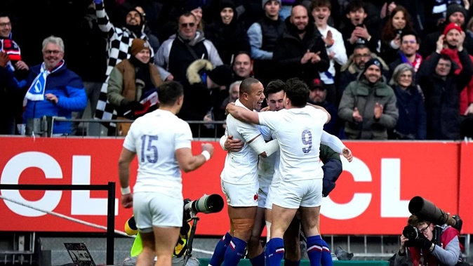 France's players celebrate after teammate Ethan Dumortier scored a try during the Six Nations match between France and Scotland. Photo / AP