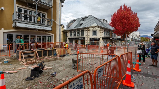 Pedestrians must navigate a maze of detours on Beach Street. Photo / James Allan