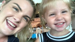 Gold Coast mum Anna Byrne, pictured with her All Blacks singlet-clad daughter Sahara Hart. Byrne is raising her two kids to support the All Blacks, despite their being born and living in Australia, like her.
