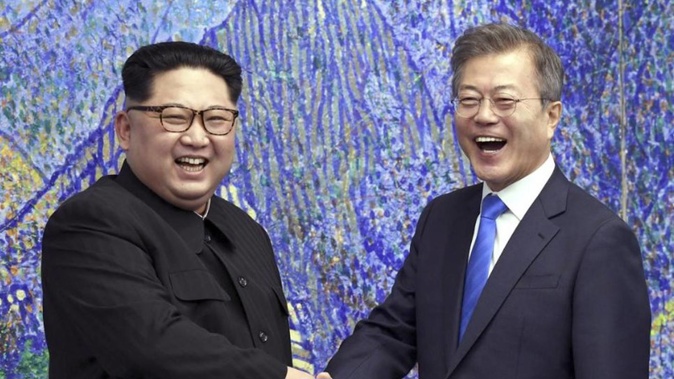 North Korean leader Kim Jong Un, left, poses with South Korean President Moon Jae-in. (Photo / AP)