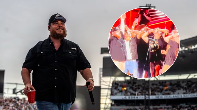 Luke Combs performed a shoey alongside rugby stars at his Eden Park concert on January 18. Photo / Corey Fleming / @zmoline