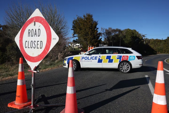 Te Anga Rd has been closed "for a couple of days" while police continue their operation. Photo / Mike Scott