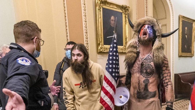 Jacob Chansley, right with fur hat, during the Capitol riot in Washington, Jan. 6. (Photo / AP)