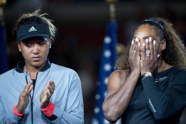 Serena Williams, right, at the trophy presentations after her controversial loss to Naomi Osaka in the 2018 US Open. (Photo / Getty)