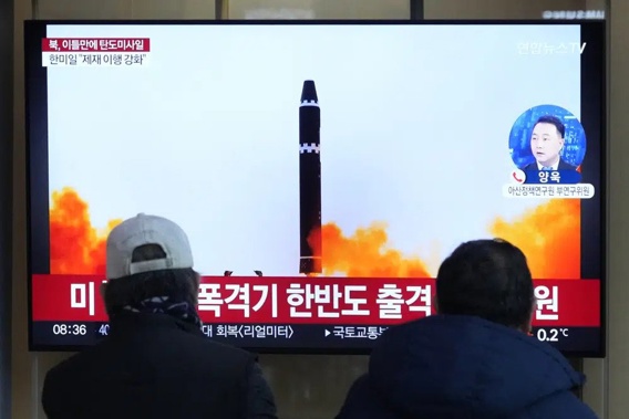 A TV screen shows a file image of North Korea's missile launch during a news program at the Seoul Railway Station in Seoul, South Korea, Monday, Feb. 20, 2023. North Korea has fired a pair of short-range ballistic missiles off its east coast on Monday, South Korea's military said, two days after the North resumed testing activities with an intercontinental ballistic missile launch. (AP Photo/Ahn Young-joon)