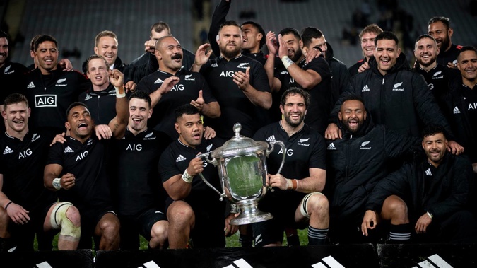 The All Blacks celebrate with the Bledisloe Cup after beating the Wallabies at Eden Park. (Photo/Dean Purcell)