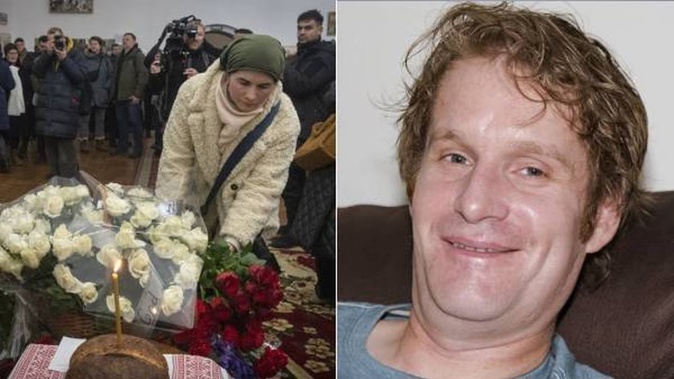 People lay flowers to commemorate British volunteer Chris Parry and Kiwi volunteer Andrew Bagshaw, right, killed in Ukraine. Photo / The Bagshaw Family via AP