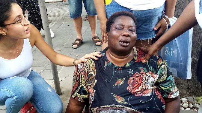 Charity Oriachi, the wife of Nigerian street vendor Alika Ogorchukwu, cries at the spot where her husband was killed, in Civitanova Marche, Italy. Photo / Chiara Gabrielli, AP