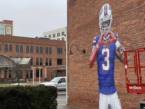 A mural by artist Adam Zyglis of Buffalo Bills player Damar Hamlin, who is recovering after going into cardiac arrest during a game Jan. 2, covers the outside of a building in Buffalo, N.Y., on Wednesday, Jan. 18, 2023. Photo / AP