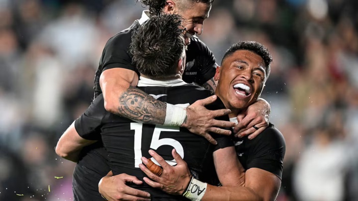 Beauden Barrett celebrates his try with TJ Perenara and Caleb Clarke during the Rugby Championship clash against Argentina at Eden Park. Photo / Photosport