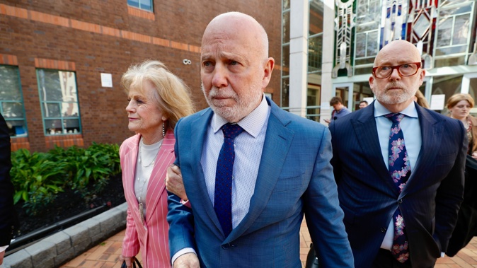 Philip Polkinghorne leaves the Auckland High Court with his sister Ruth Hughes and defence lawyer Ron Mansfield KC after the not guilty verdict. Photo / Dean Purcell