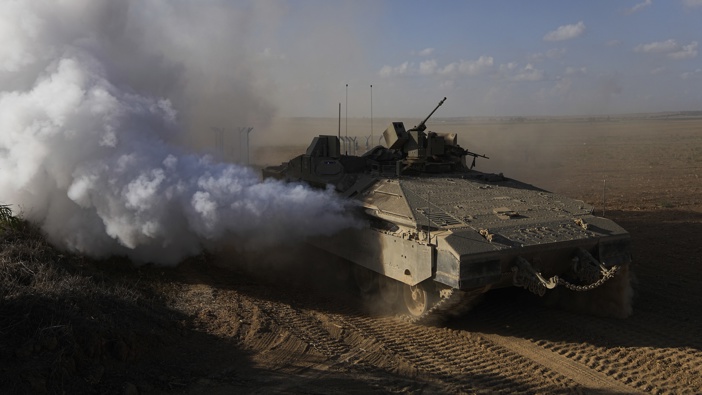 A convoy of Israeli armoured personnel carriers (APC) head towards the Gaza Strip border in southern Israel on Sunday, Oct. 15, 2023. Photo / AP