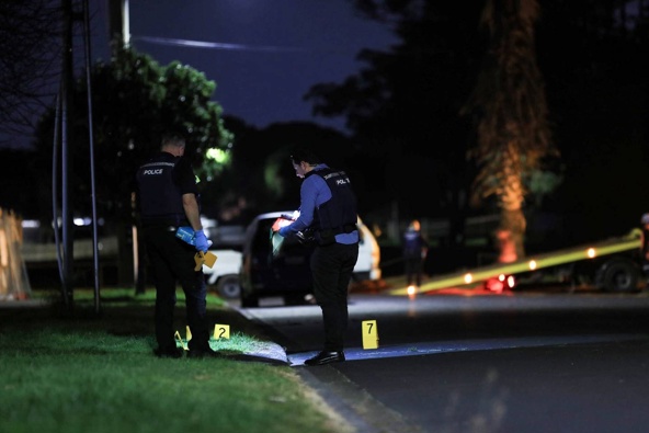 Police officers at the scene of a disorder event where a person was shot dead at Taurima Reserve in Point England, Auckland on Saturday. Photo / Hayden Woodward