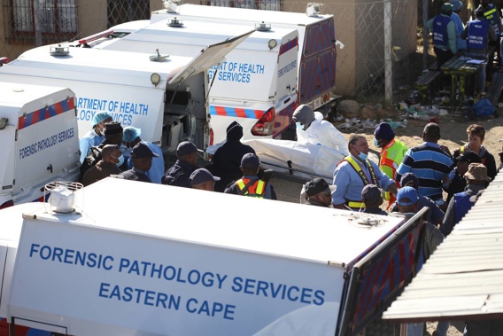 A body is removed from a nightclub in East London, South Africa on June 26, 2022, where at least 21 people died. (Photo / AP)