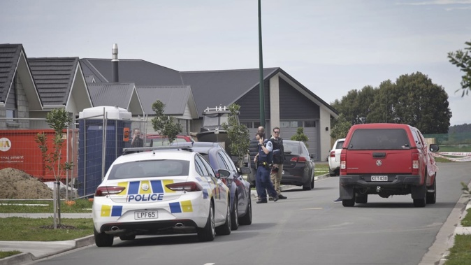 Police cordoned off houses on Harding Drive, Pāpāmoa East, after a stabbing incident on September 22, 2018. Photo / Andrew Warner