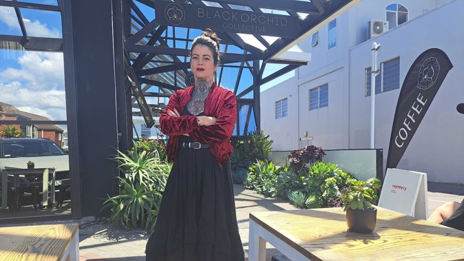 Black Orchid Collective cafe and tattoo shop owner Veronica de Oliveira says being charged $750 plus GST and a $500 administration fee for placing three small dining tables on the footpath is "ridiculous". Photo / Sandra Conchie