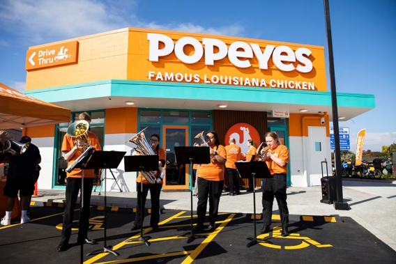 A brass band was present to celebrate the opening of the first Popeyes restaurant in Auckland.
