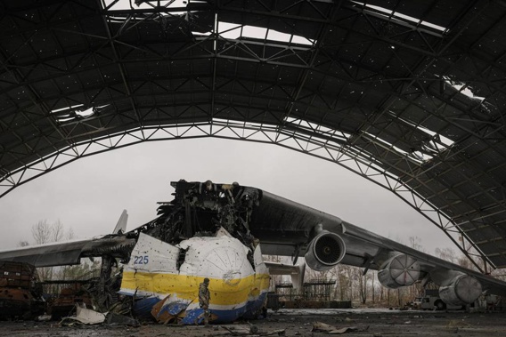 A Ukrainian serviceman walks by an Antonov An-225 Mriya aircraft destroyed during fighting between Russian and Ukrainian forces on the Antonov airport in Hostomel, Ukraine. (Photo / AP)