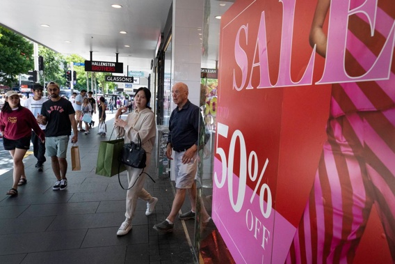 Big signs and big discounts lure consumers with many buying big ticket items such as televisions and tech equipment on Boxing Day. Photo / Brett Phibbs