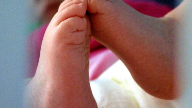 After a newborn baby died, police arrested the grieving father for aggressive behaviour. A coroner says that made it difficult to establish the cause of death, as the father was discouraged from cooperating with a subsequent investigation. Photo / Bradley Ambrose
