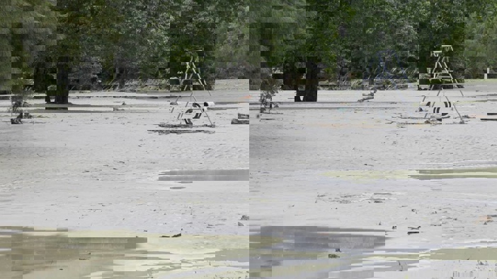 Esk River silt coats a playground in the immediate aftermath of Cyclone Gabrielle