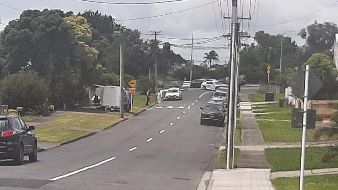 Police can be seen in the distance investigating an assault on a woman inside her Murdoch Crescent home in Raumanga. Photo / NZME