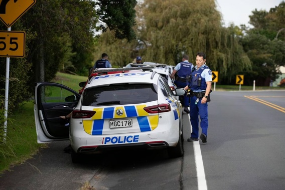 Police at the property in Massey, West Auckland where a pre-planned operation took place this morning. Photo / Hayden Woodward