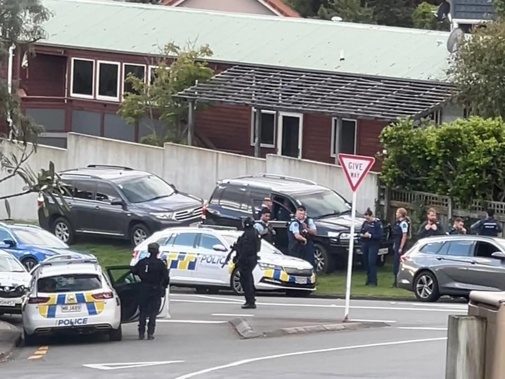 Police are gathered on Grays Rd, Plimmerton.