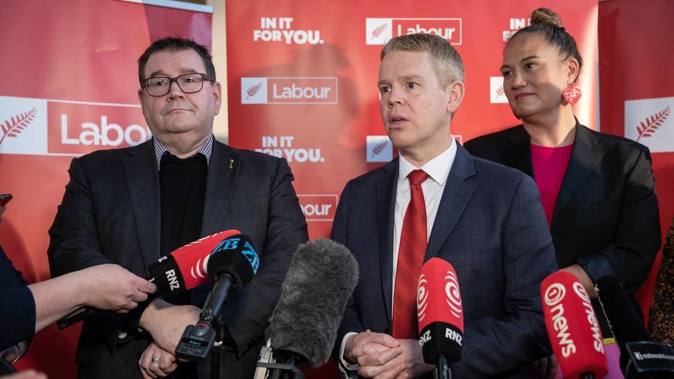 Labour leader Chris Hipkins, flanked by Grant Robertson and Carmel Sepuloni, announcing their tax policy. Photo / Mark Mitchell