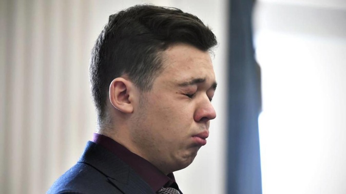 Kyle Rittenhouse closes his eyes and cries as he is found not guilty on all counts at the Kenosha County Courthouse. (Photo / AP)