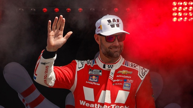 Shane Van Gisbergen waves to fans as he walks onstage prior to the Nascar Cup Series Go Bowling at The Glen at Watkins Glen International. Photo / Getty Images