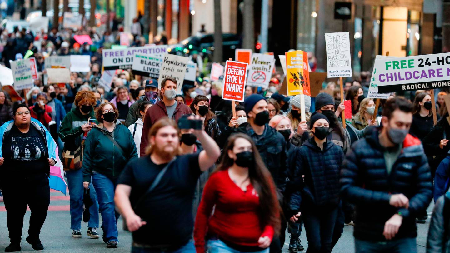 Thousands of people march up Pike Street after a rally at Westlake Park in Seattle. (Photo / AP)