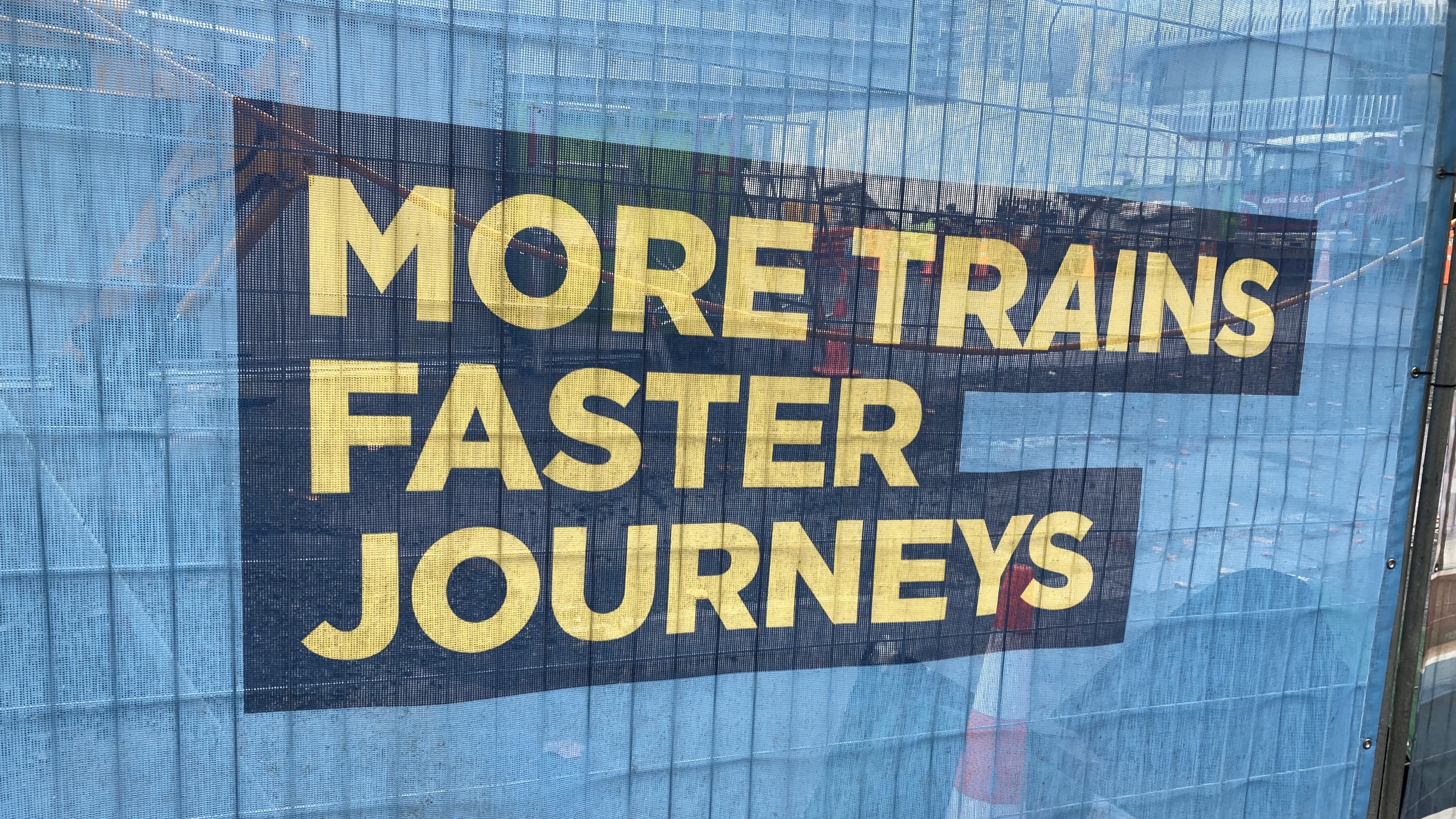 A sign erected on a City Rail Link site promoting more trains and faster journeys. Photo / Supplied