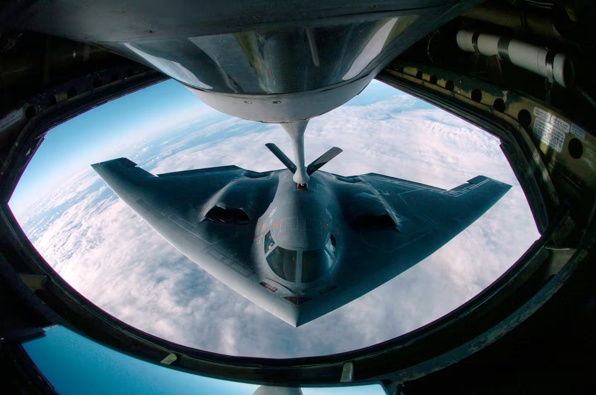 A B-2 Spirit multi-role bomber conducting air refueling operations with a KC-135 Stratotanker over the Pacific Ocean. Photo / file