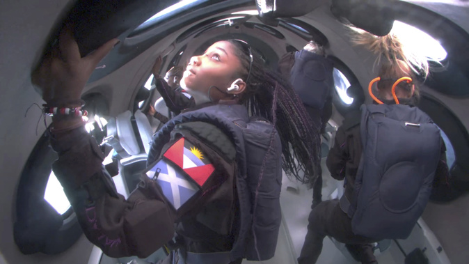 This photo provided Virgin Galactic shows passengers during Virgin Galactic's first space tourism flight on Thursday Aug. 10, 2023. Photo via AP