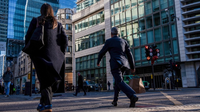 Commuters make their way into work during the morning rush hour in the City of London, UK. Photo / Getty
