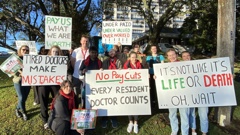 Junior doctors with the New Zealand Resident Doctors Association, pictured with signs outside Whangārei Hospital, say their pay is a matter of life and death. Photo / Denise Piper