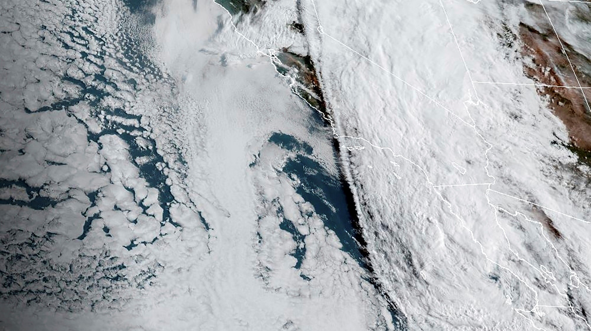 A satellite image provided by the National Oceanic and Atmospheric Administration shows Tropical Storm Hilary, right, off Mexico’s Pacific coast. Photo / AP
