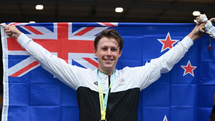 Corbin Strong celebrates gold in the Scratch Race in Birmingham. Photo / Getty