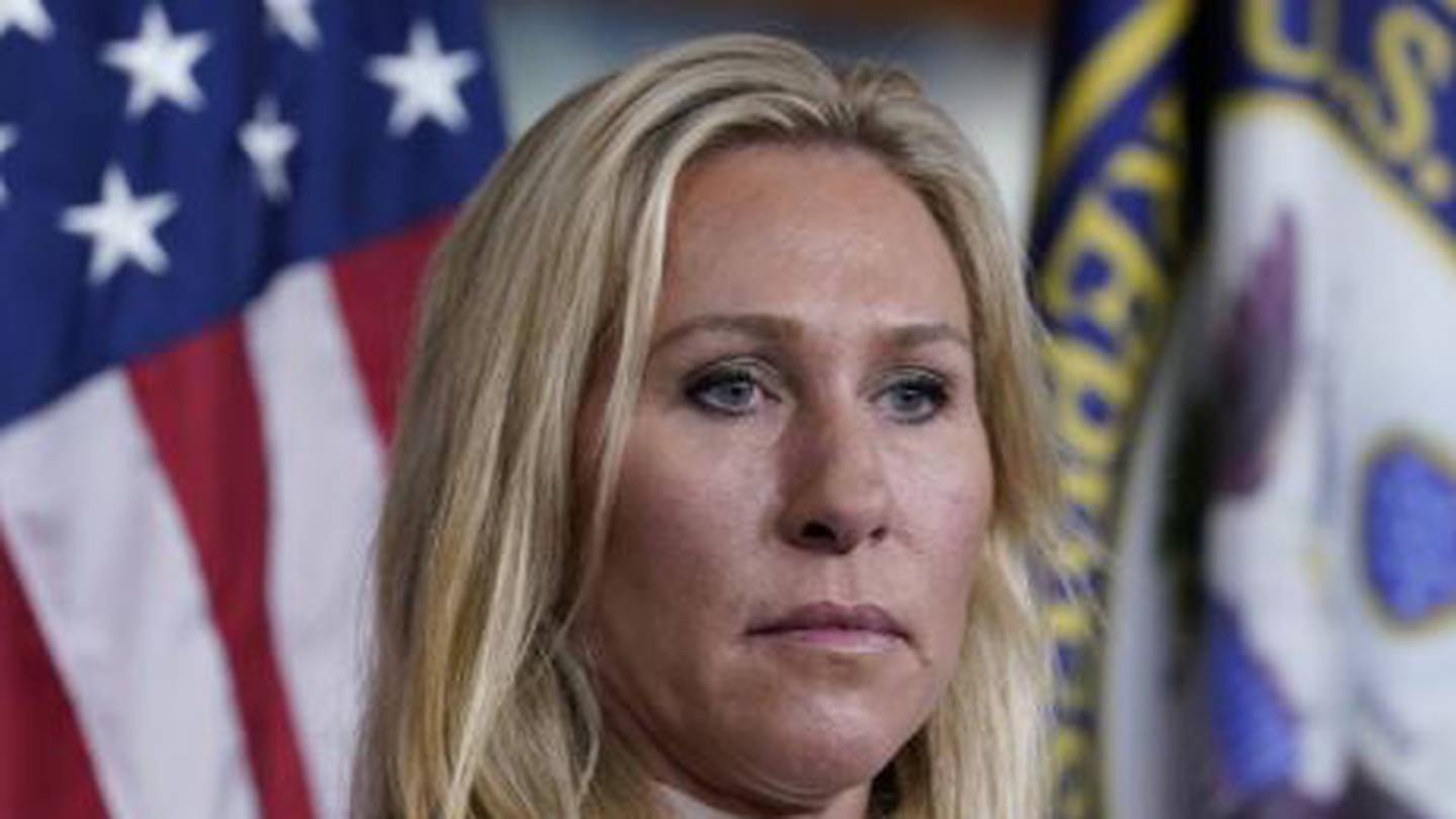 Rep. Marjorie Taylor Greene listens during a news conference about the treatment of people being held in the District of Columbia jail. Photo / AP