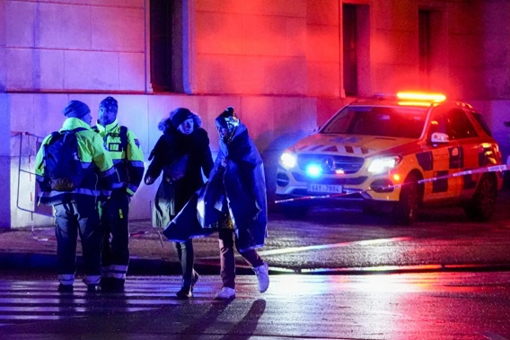 People leaving Charles University in Prague where a mass shooting killed several people. Photo / AP