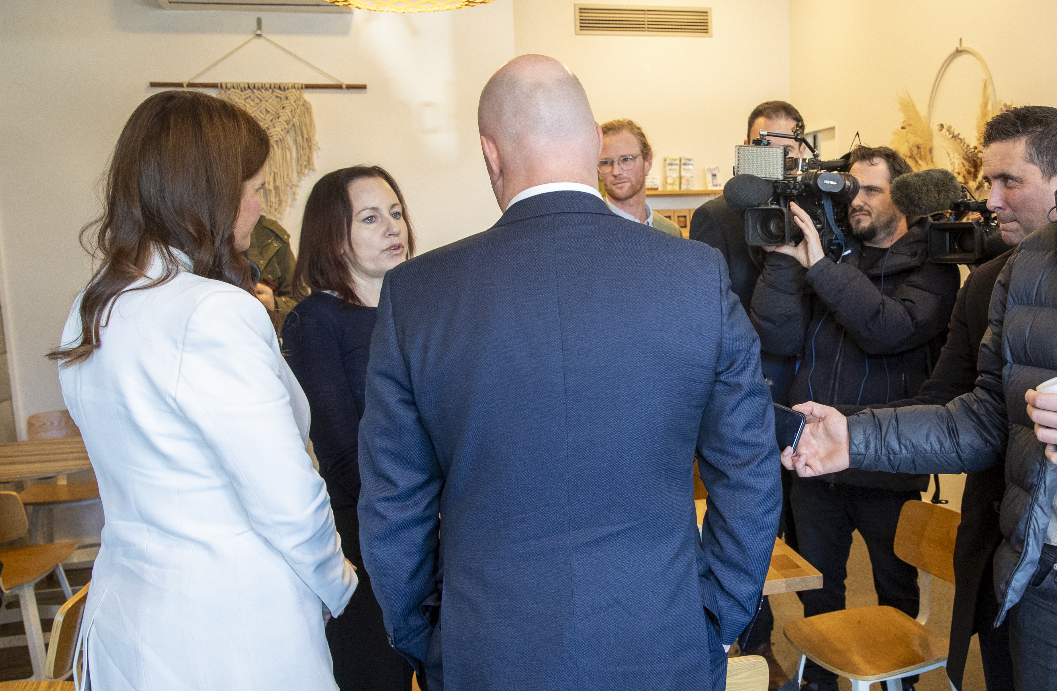 Tawa Urban Eatery owner Michelle Cam chats to National's Nicola Willis & Chris Luxon. Photo / Mark Mitchell