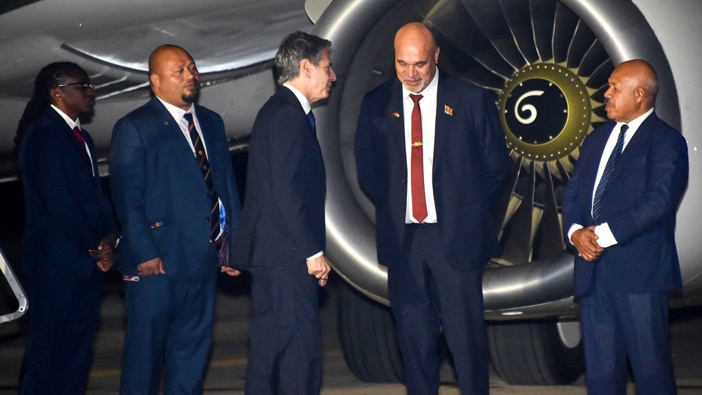 Papua New Guinea's Deputy Prime Minister John Rosso greets US Secretary of State Antony Blinken in Port Moresby on May 21, 2023.