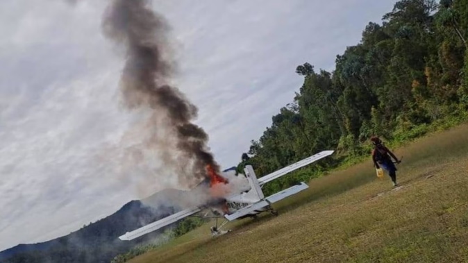 The Susi Air plane that Phillip Mehrtens was piloting torched by rebels. Photo / TPNPB