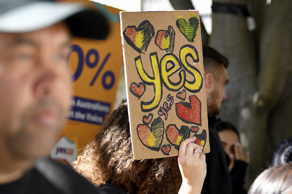 A woman holds a hand-made "Yes" sign as supporters gather at the Redfern Community Centre in Sydney, Monday, Oct. 9, 2023. Photo / AP