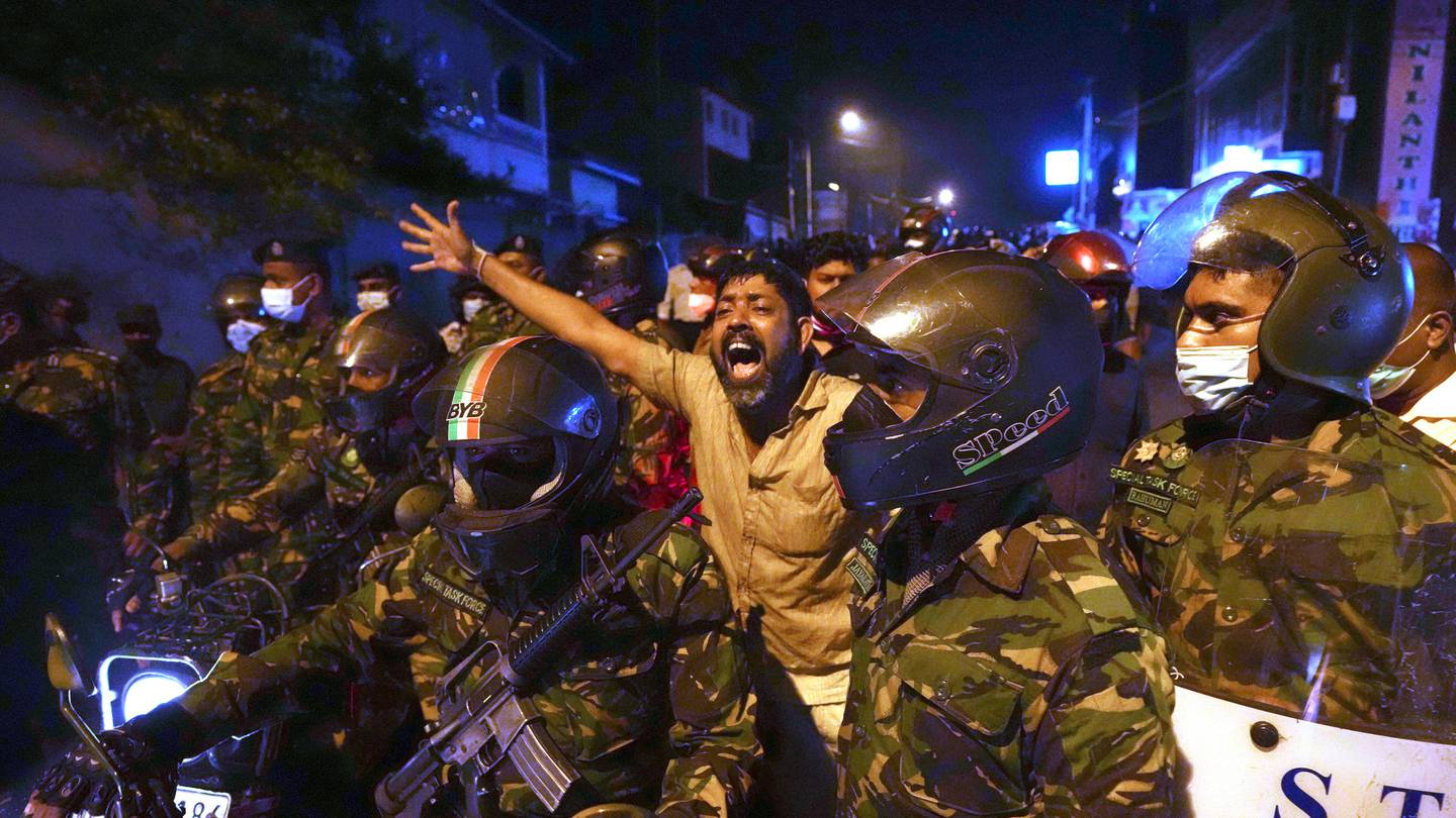 A man shouts anti-government slogans during a protest on the outskirts of Colombo, Sri Lanka. Photo / AP