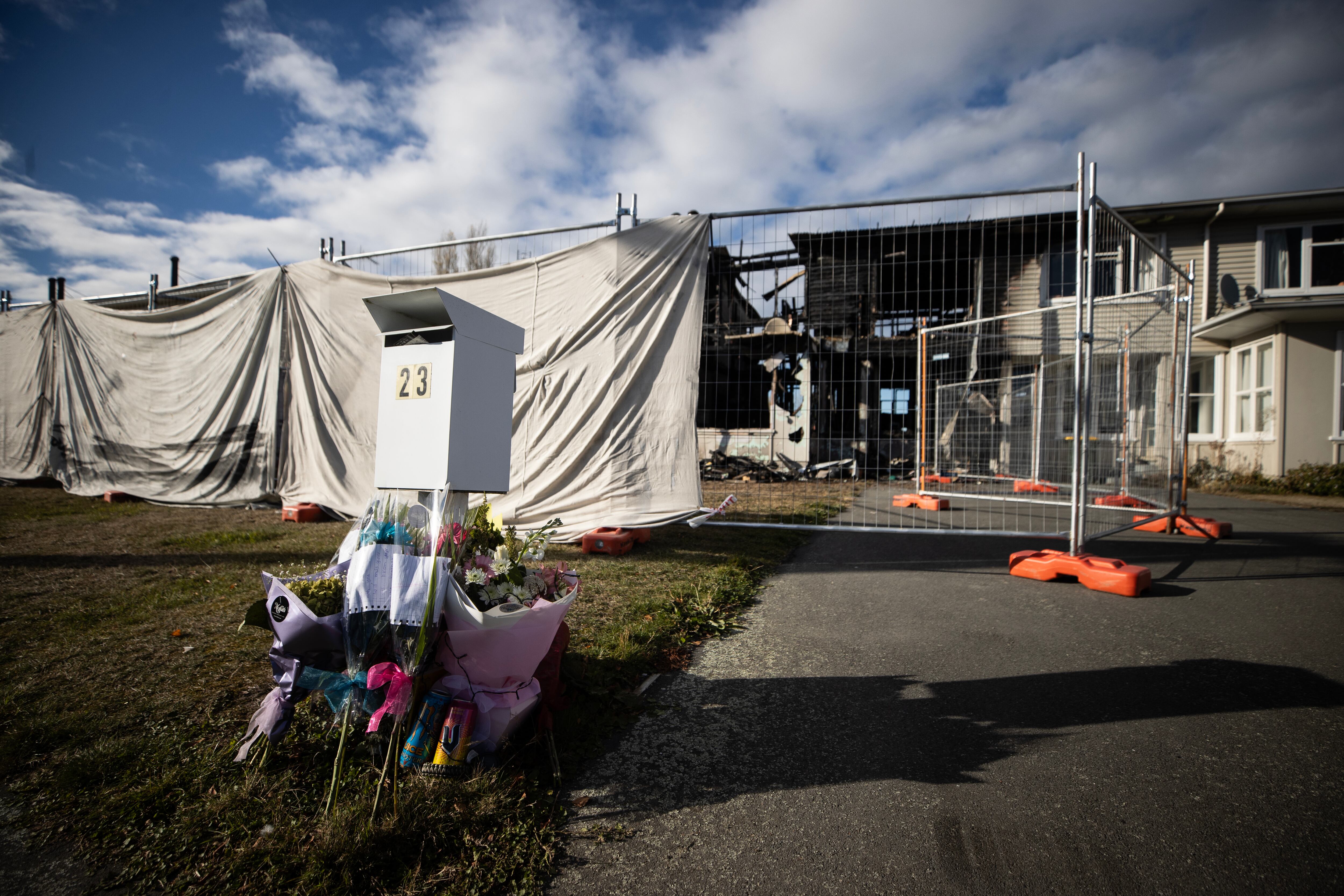 Flowers and notes have been left at the house where teen Lizzy Marvin died. Photo / George Heard
