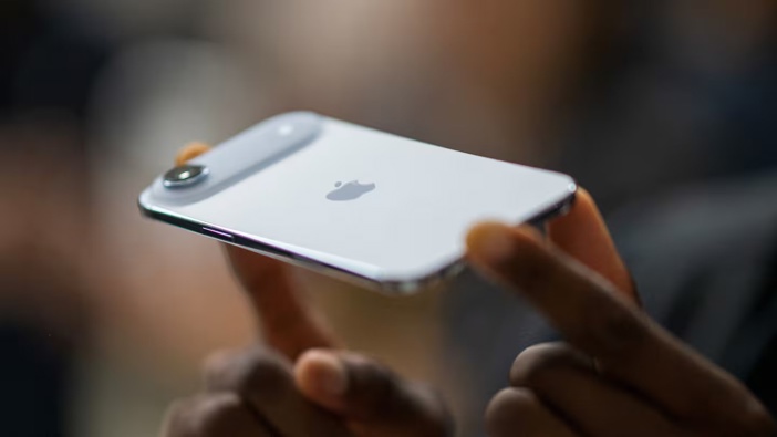 A person holds an Apple iPhone Air during Apple's "Awe-Dropping" event at the Steve Jobs Theatre on the Apple Park campus in Cupertino, California. Photo / Nic Coury, AFP