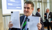 RMA Reform Minister Chris Bishop with copies of the Bills after announcing the Government’s proposed RMA reforms. Photo / Mark Mitchell